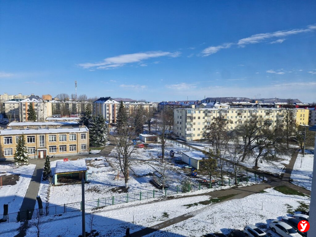 город